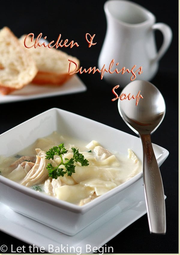 Chicken and dumplings soup topped with greens in a white bowl and white plate with a spoon.