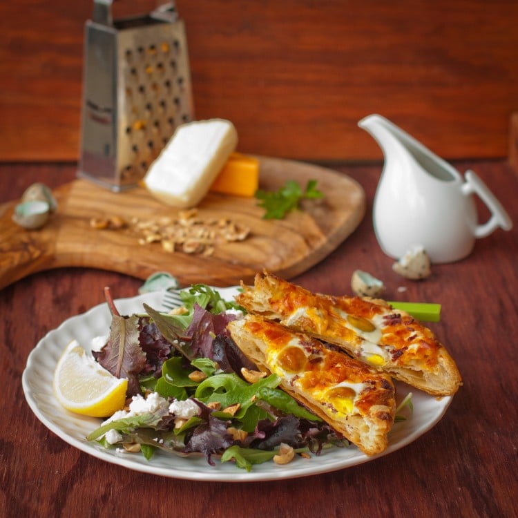 Egg Tart and Green Salad w/ Walnuts and Honey Mustard Dressing on a plate.