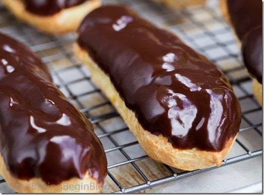 Classic Eclair filled with Custard and topped w/ Chocolate Glaze. by Let the Baking Begin!