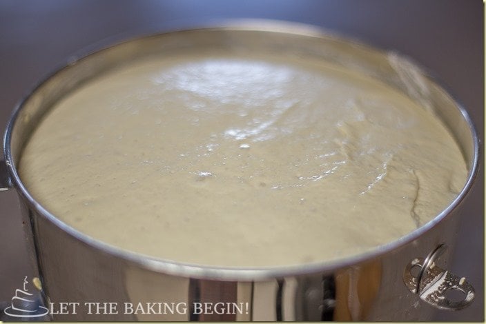 Allowing the bread dough to rise and double in size.