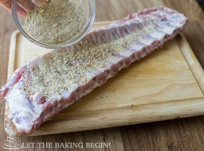 How to pour dry rub over meat and press in with your hands.