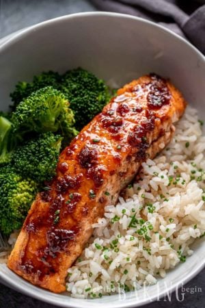 Honey Glazed Salmon on top of rice with a side of broccoli in a bowl.