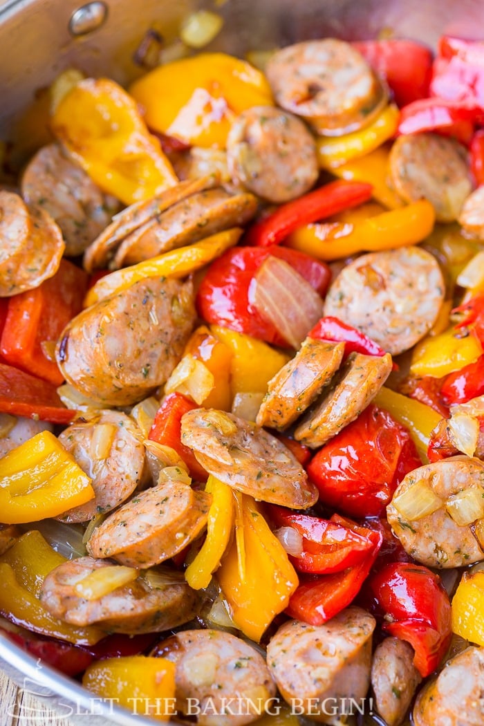 The sausage, peppers and onions are sauteed before the sauce is made in the same skillet and the pasta is added.