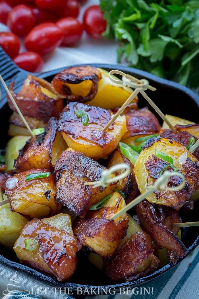 Bacon Wrapped Potatoes - Potato pieces, tossed in BBQ sauce and lovingly wrapped in smoked bacon, then roasted to crispy golden perfection. By LetTheBakingBeginBlog.com | @Letthebakingbgn