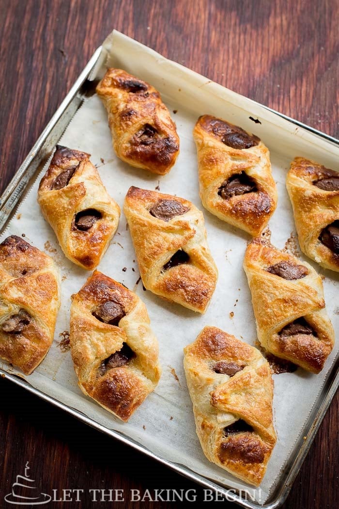 Nutella puff pastry Danishes on a baking sheet.