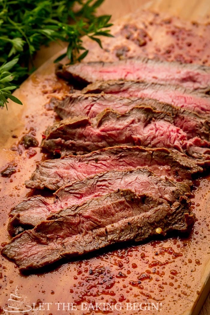 Steak slice on a cutting board.