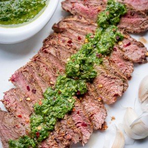 Chimichurri Sauce Recipe is must-know recipe if you love meat and fish! You can serve this garlicky, herb goodness with literally any meat or fish, be it cooked, grilled or even sautéed. The sauce takes seconds to whip up, just load the blender or a food processor with ingredients and whizzzzz!
