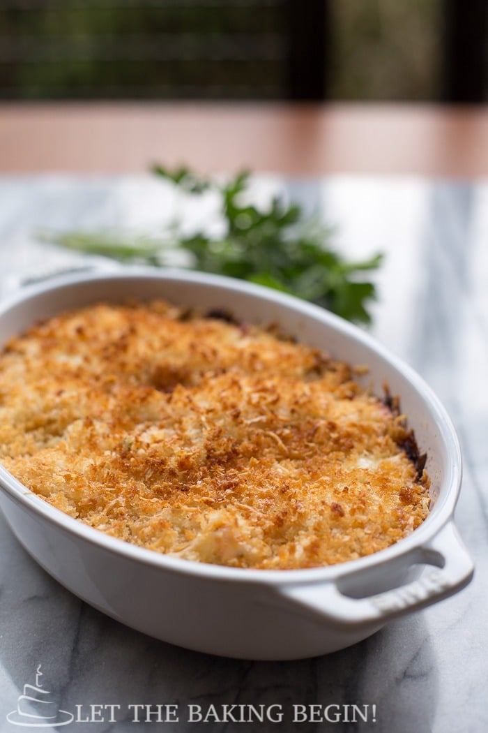 Cheesy Parmesan Crusted Salmon Bake in a casserole dish.