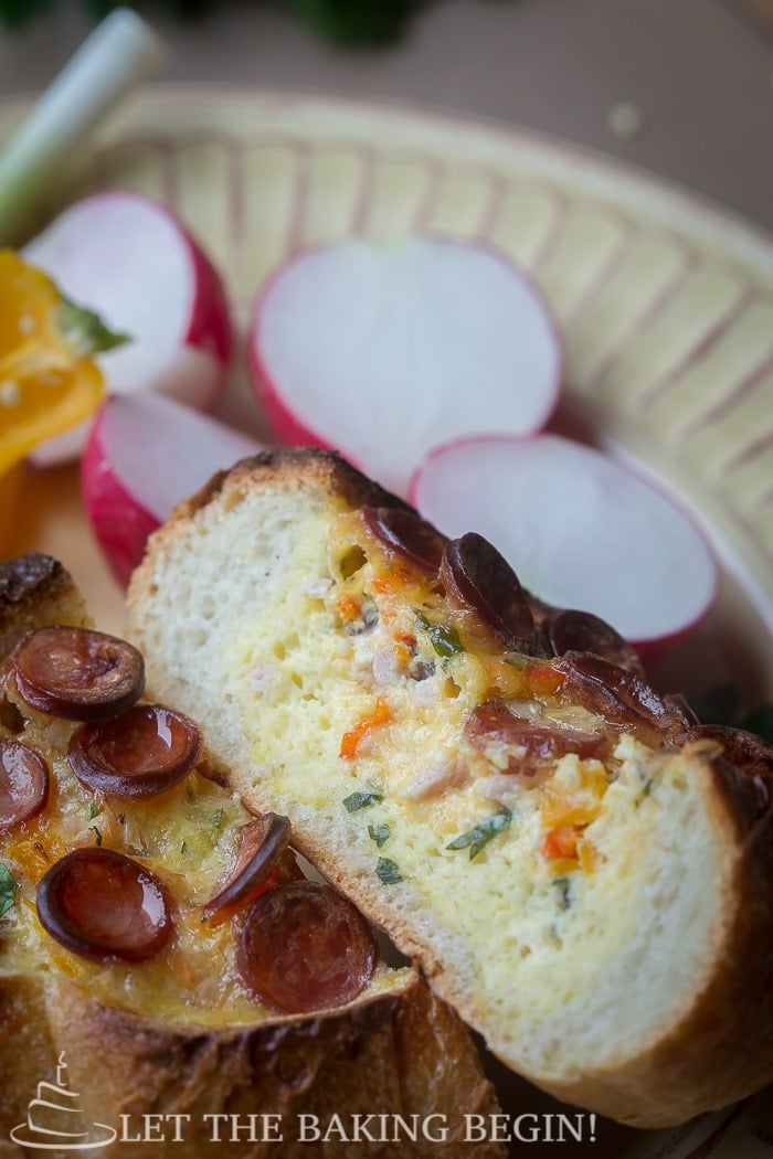 Egg and Sausage Stuffed Breakfast Boats - an easy-peasy breakfast that is filled with all things delicious – cheese, sausage and egg. By LetTheBakingBeginBlog.com | @Letthebakingbgn 