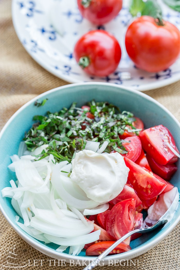 Creamy Tomato Salad is best made with fresh, heirloom tomatoes, loads of basil and sweet onion. This is the summer salad that you will be making, over and over again!