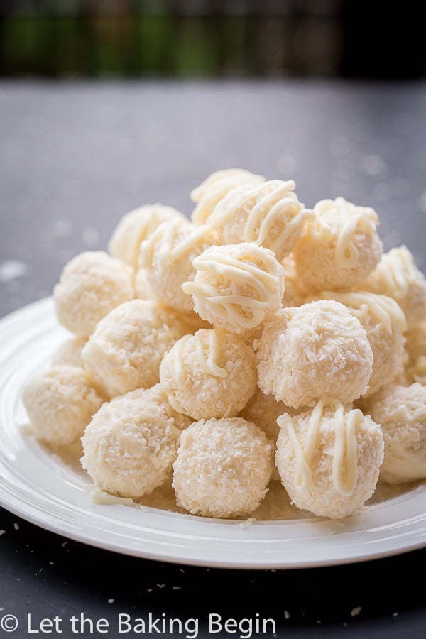 White chocolate coconut candies on a white plate. 