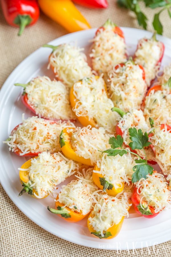 Sweet pepper appetizer topped with cheese on a white plate. 