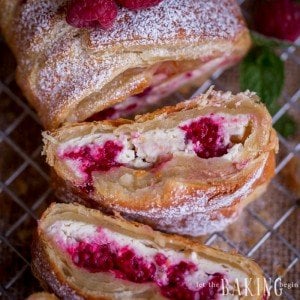 Raspberry Cheesecake Danish - Puff pastry braid filled with cheesecake and raspberries is impressive as it is easy to make. Follow the step by step picture instructions for a homemade dessert that take only 30 minutes to make! By Let the Baking Begin!