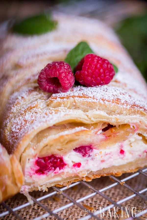 Puff pastry braid filled with cheesecake and raspberries is impressive as it is easy to make. Simple and delicious puff pastry recipe! 