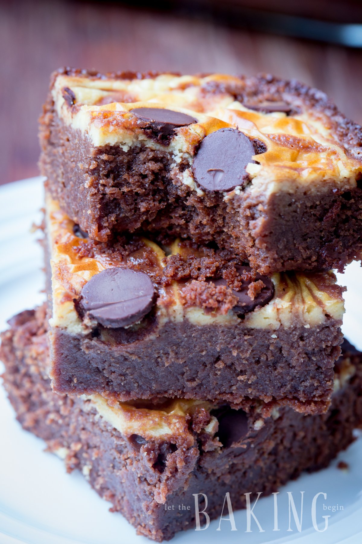 The best brownie recipe stacked on top of each other with a cheesecake swirl.
