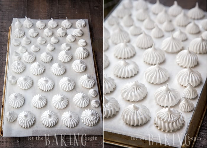 Piped out meringue cookies on a parchment lined baking sheet.