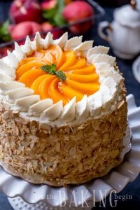 Peaches and Cream Cake Recipe - Easy Dessert made of Soft layers of Sponge Cake with Chunky Peach Preserve and lightly sweetened Whipped Cream. Roasted Almonds add a nice pleasant crunch for a textural contrast. | By Let the Baking Begin!
