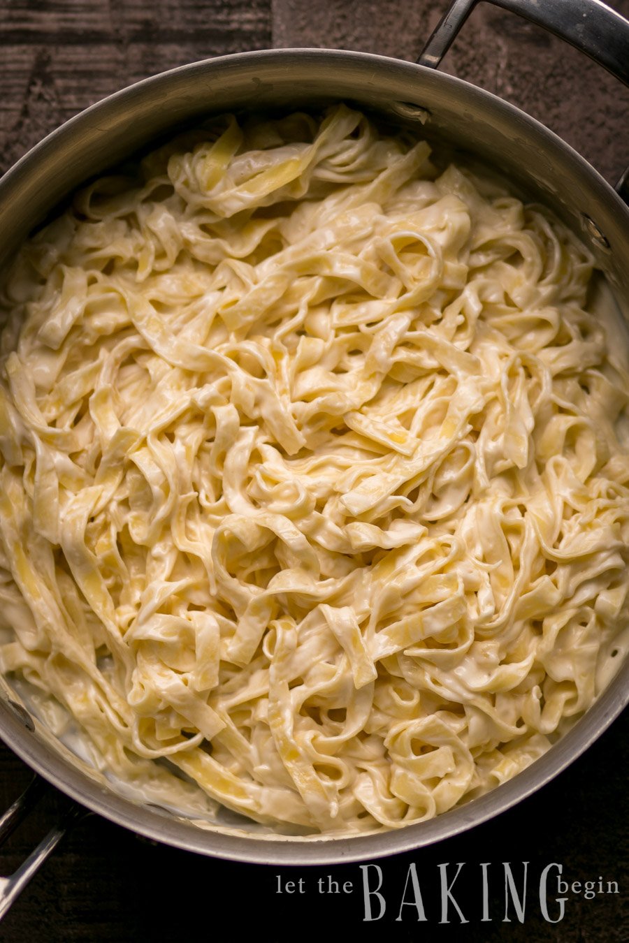 Pasta in sweet cream cheese sauce in a pan. 