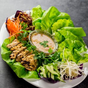 Thai Chicken Lettuce Wraps and Peanut Sauce - Perfect as a Light Dinner or a Fancy Appetizer. The Peanut Sauce can be used for Wraps, Salads and even Thai style pasta.
