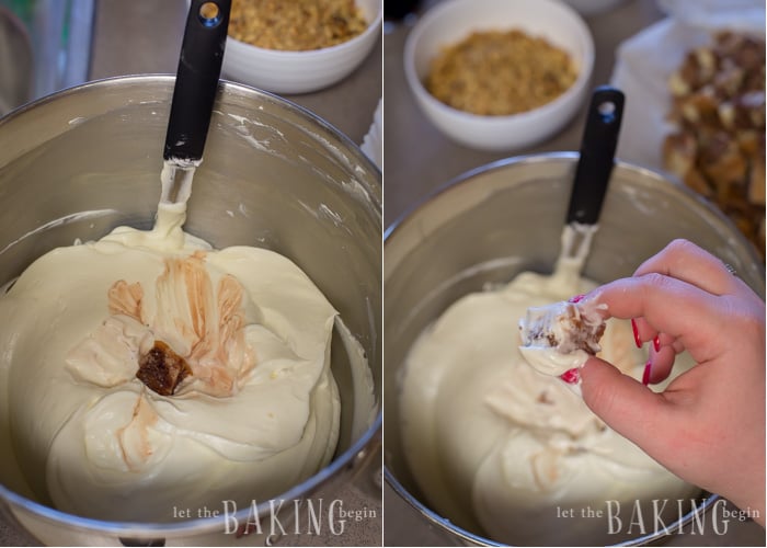 How to drop the soaked marble cake cube into sour cream frosting and rotate it so the cube collects some frosting all around. 