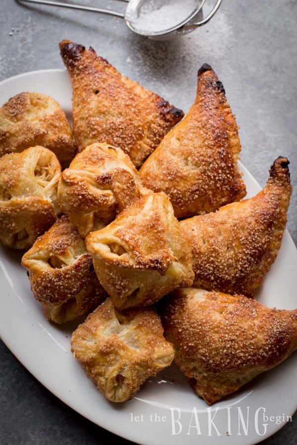 Puff pastry apple turnovers on a platter. 