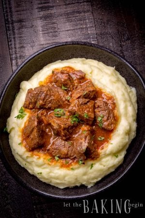 Beef Stew made in an Instant Pot with Beef, Onions, Carrots, Tomato Sauce and Spices. No fancy ingredients, but super delicious! Serve with Mashed Potatoes, Rice or Pasta and you'll have the ultimate comfort food dinner experience!
