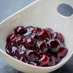 Cherry Sauce is a basic recipe for simple cherry sauce that is easy to make and a delight to eat. Use it to top cheesecakes, ice cream, crepes and oatmeals or fill turnovers with it. Very easy to make and super delicious to eat! Made with just a handful of ingredients, this one will become your summer favorite!
