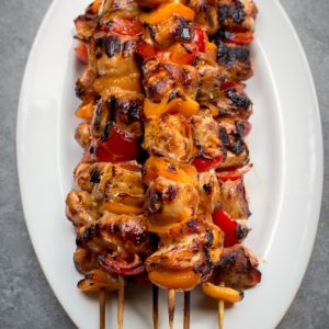 Bacon Wrapped Pork Kabobs - Juicy Kabobs are made even more amazing with the addition of smoky bacon. They're perfect for a summer picnic BBQ. Even you'll be surprised at the amount of flavor packed into these Grilled Kabobs!