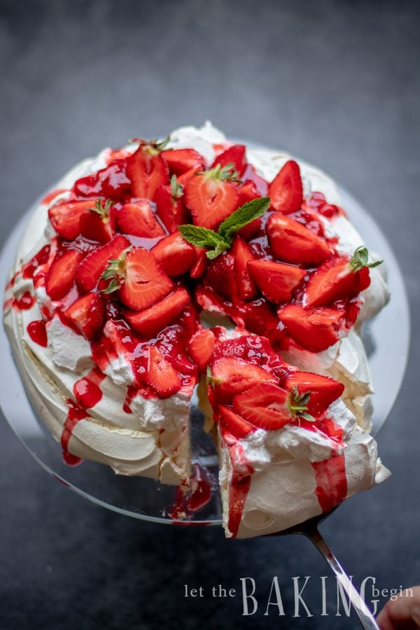 Strawberry Pavlova on a glass cake stand. View from the top.