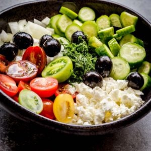 Cucumber Tomato Goat Cheese Salad is a refreshing spin on your Classic Cucumber Tomato Salad. The addition of creamy goat cheese and black olives adds an unexpected creaminess and tang to this delicious summer staple.
