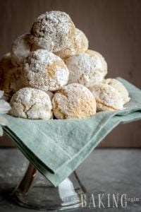 Almond Cookies stacked on a cake tray.