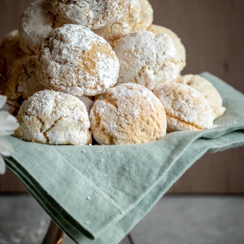 Almond Cookies stacked on a cake tray.