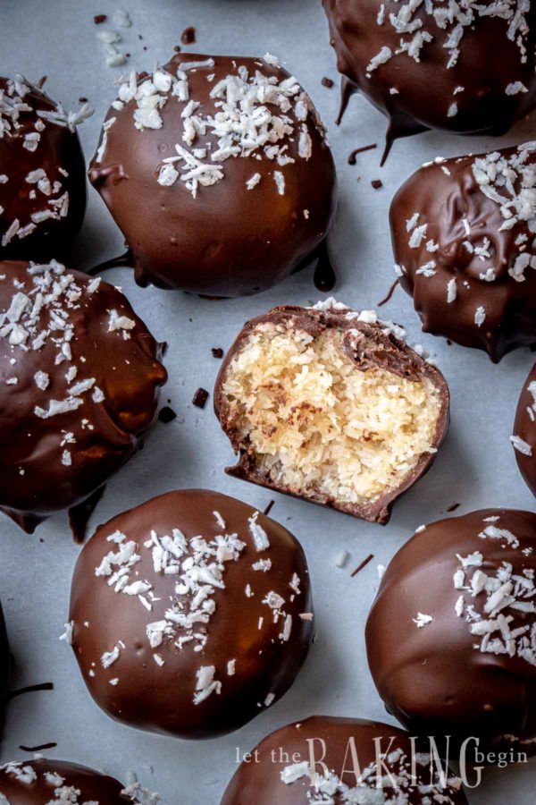 close up of coconut bonbons covered in chocolate.