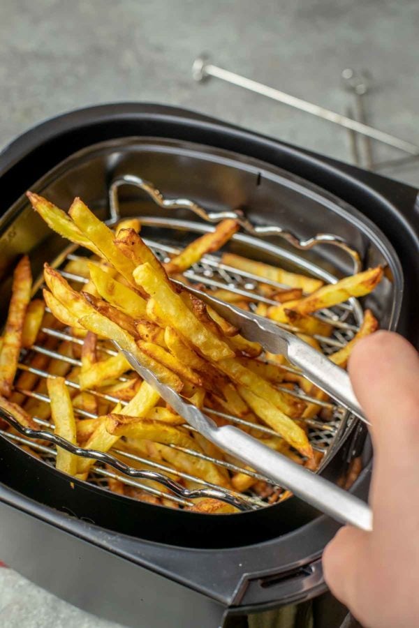 Air fryer French Fries are the deep fried french fries' healthy cousins. The potatoes are cooked with just a tiny amount of oil but still have a ton of flavor and crispiness.