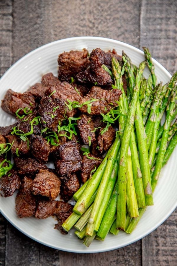 Air Fryer Steak Tips with Asparagus on a plate.