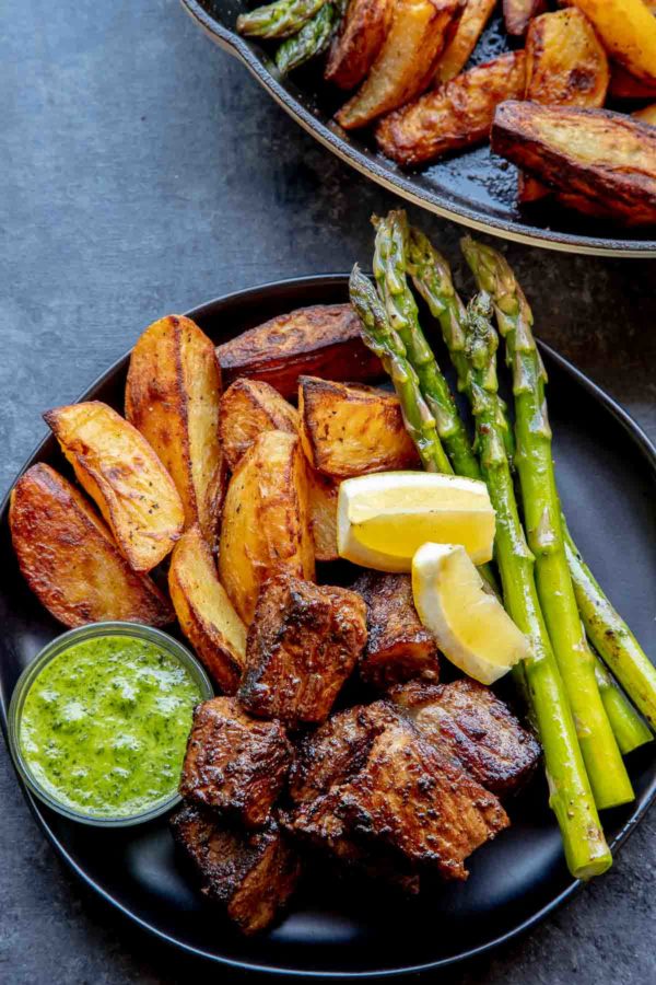 Roasted Yukon Gold Potatoes with steak bites and asparagus.