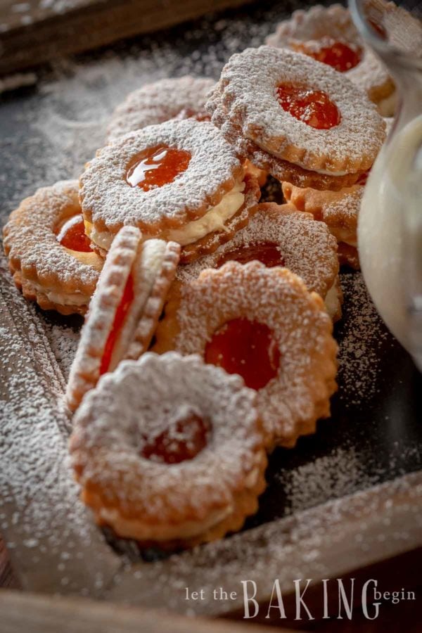 Shortbread cookies with jam dusted with powdered sugar