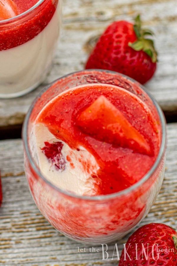 Panna cotta in a glass with strawberry puree on top