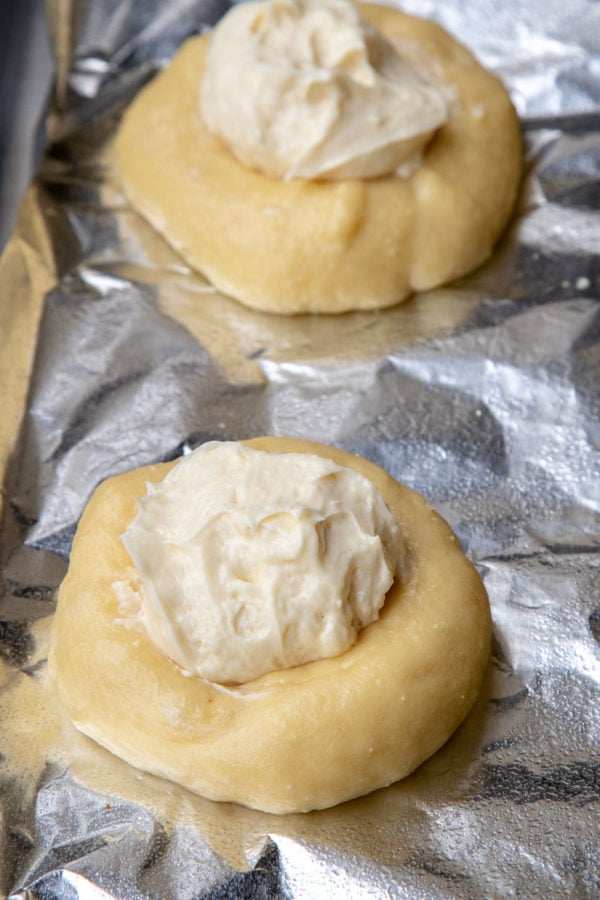 Cream cheese danish before baking with freshly made cream cheese filling.