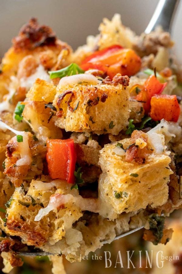 Close up of a homemade stuffing recipe with croutons, bell peppers, sausage and herbs.
