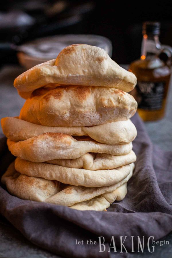 A tall stack of pita bread.