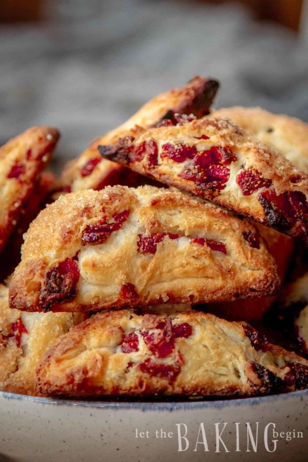 Close up of a stack of strawberry scones in a bowl