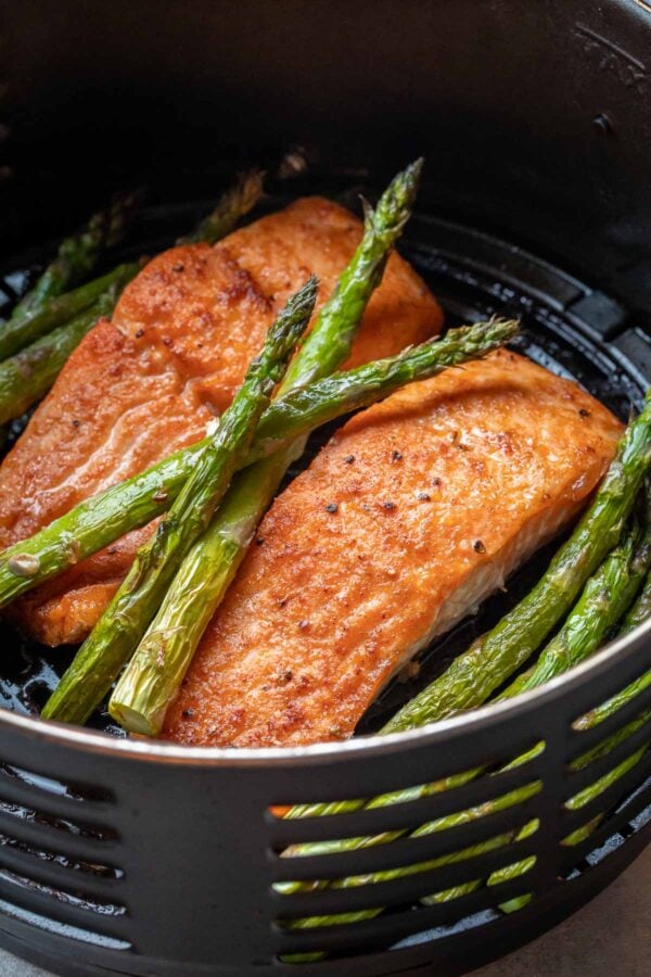 Air Fried salmon fillets in the air fryer with spears or asparagus.