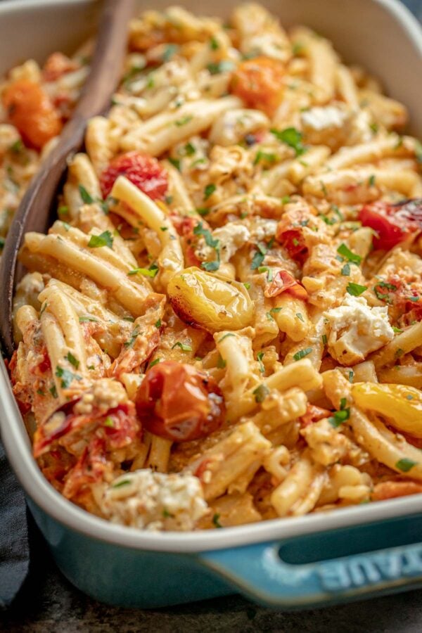 baked feta pasta with tomatoes in a dish