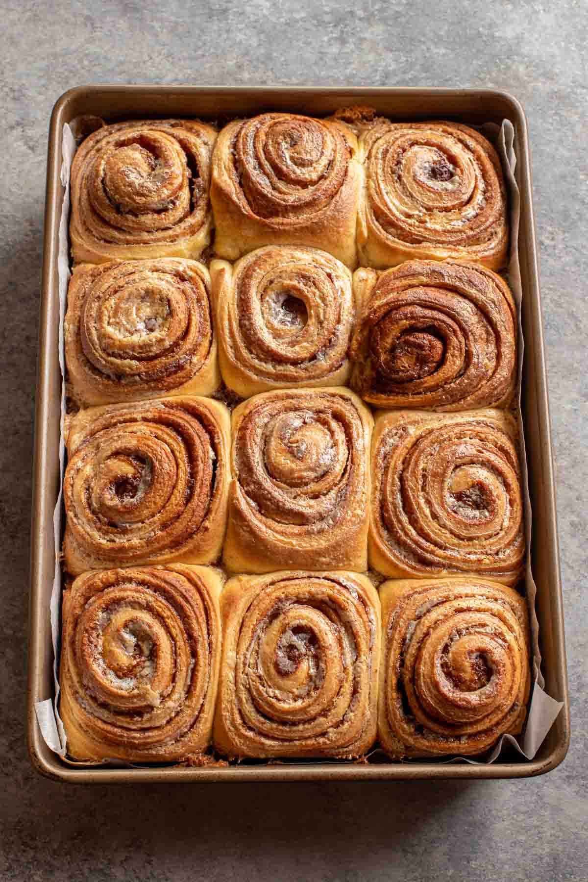 A pan full of fluffy cinnamon rolls without the cream cheese icing. 