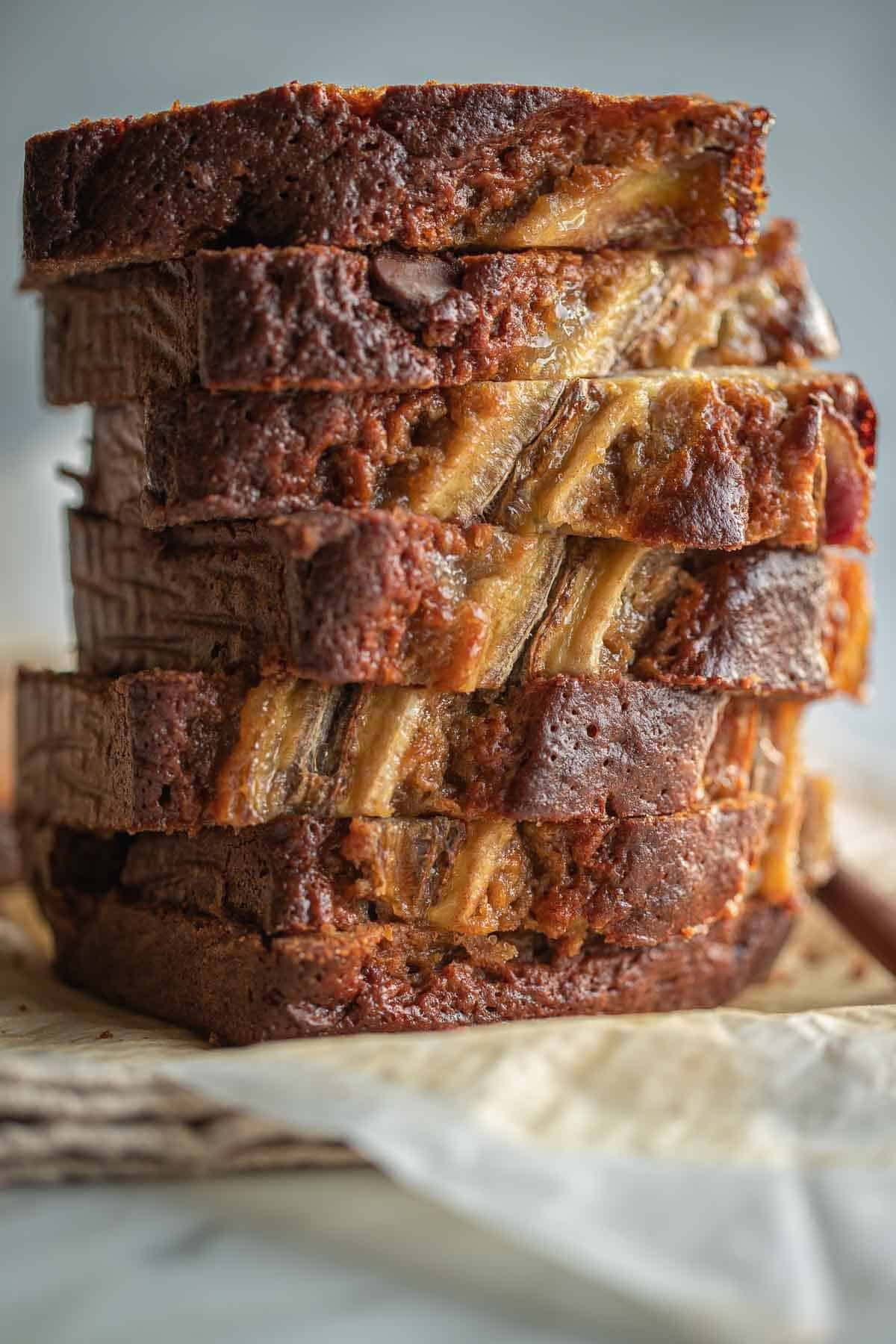 Close-up of a moist banana bread slice studded with chocolate chips