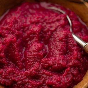 Beet horseradish (cwikla) in a wooden bowl with a spoon