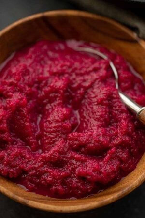 Beet horseradish (cwikla) in a wooden bowl with a spoon